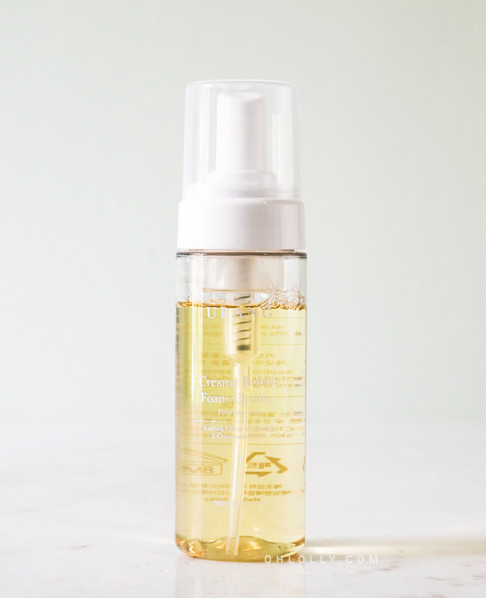 Pump bottle of Urang Creamy Bubble Foam Cleanser, a vegan, all-natural cleanser with calming chamomile and calendula for sensitive skin.
