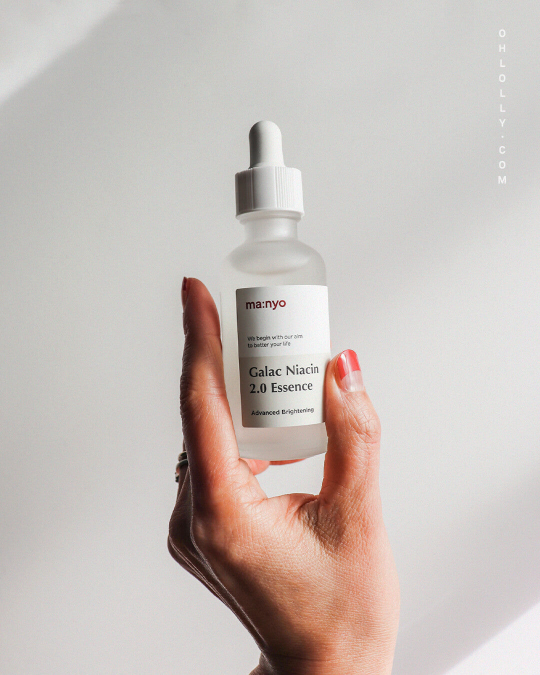 ma:nyo Galac Niacin 2.0 Essence_K-Beauty Cult Face, Brightening Essence, hand holding the product, hero image