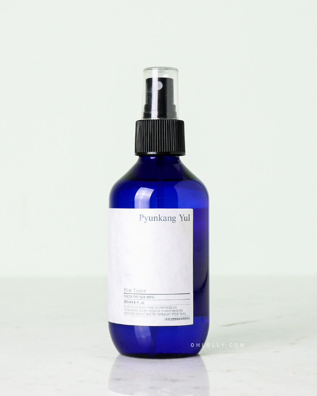 Studio shot of the 200 ml Pyunkang Yul Mist Toner in a dark blue spray bottle with a black cap. The bottle has a simple white rectangular label and is centered on a light background.