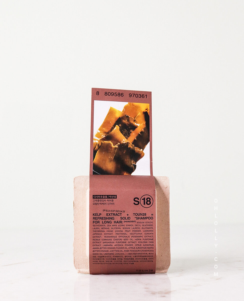 Toun28 S18 green shampoo bar with kelp extract on plain background