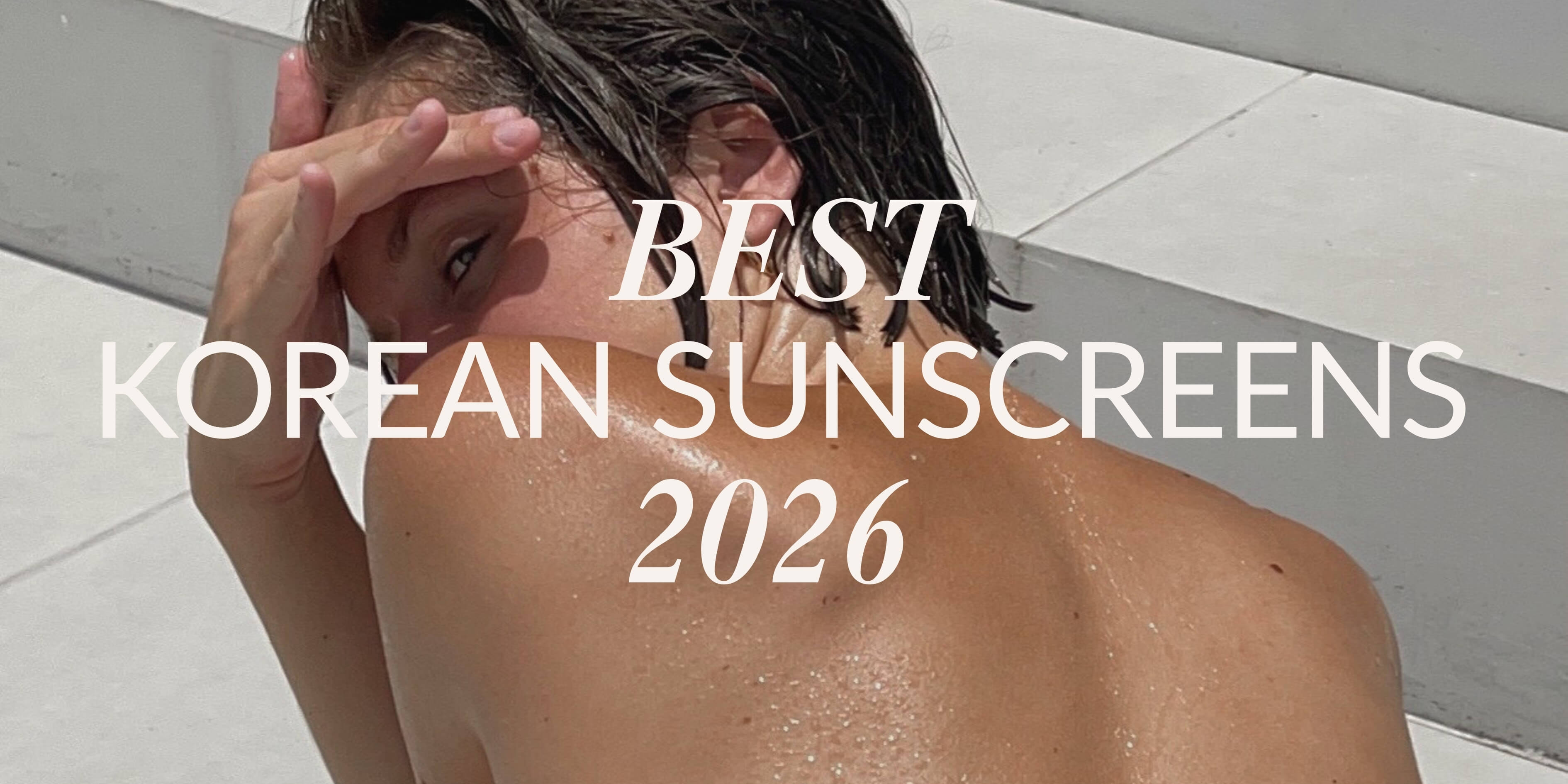  Gemini said A close-up of a person with glowing skin on white steps, featuring the text Best Korean Sunscreens 2026 in a modern font.