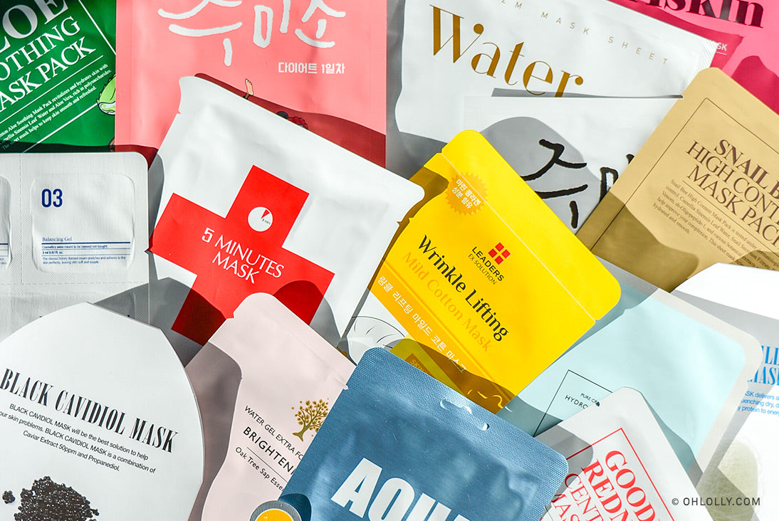 A flat lay image showing a variety of colorful K-Beauty sheet masks from different brands.