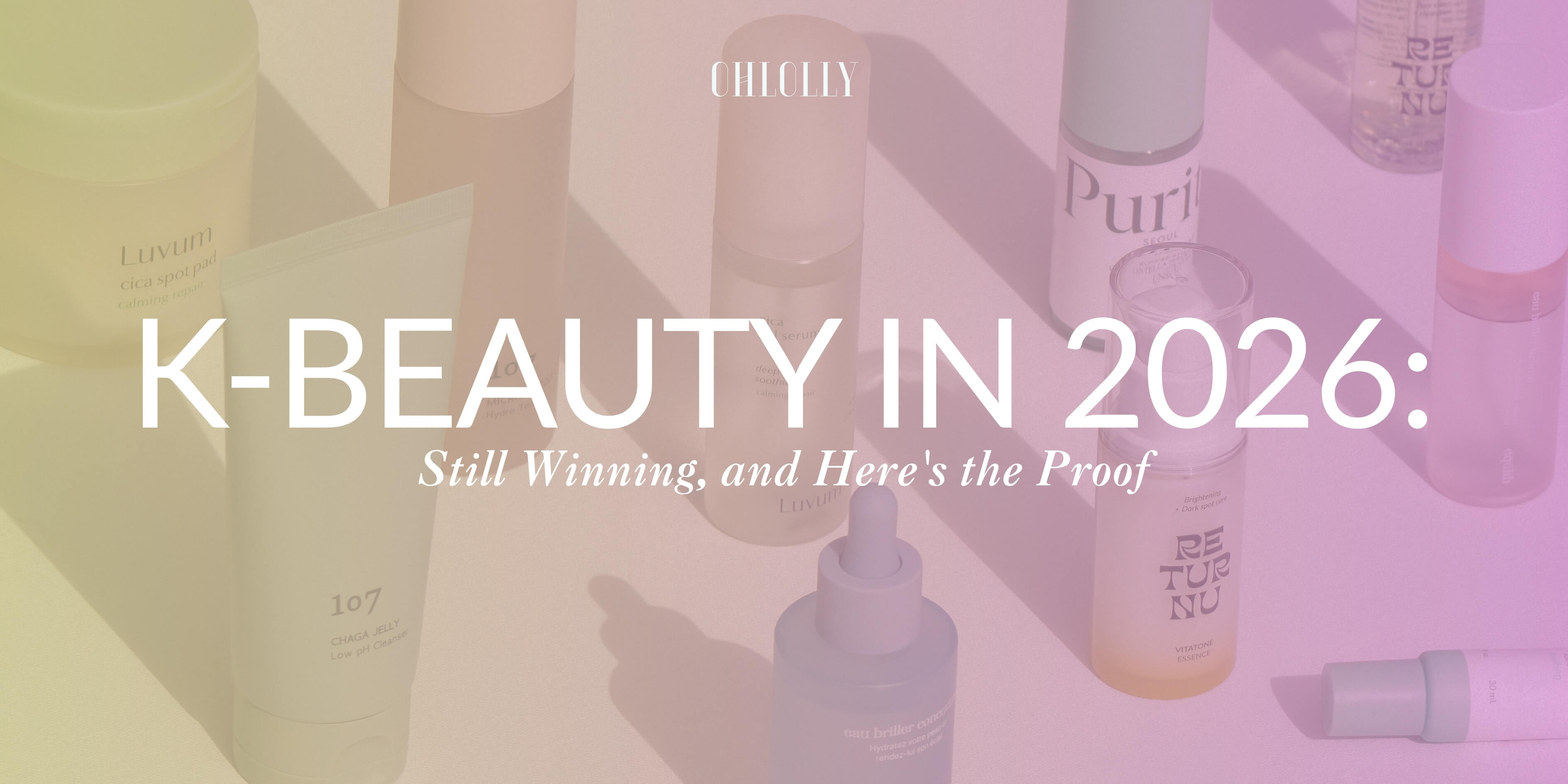A colorful graphic with pastel gradient tones displaying various skincare products with the text "K-BEAUTY IN 2026: Still Winning, and Here's the Proof."