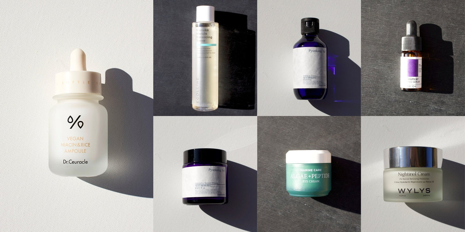 Grid of eight different K-beauty skincare products, including ampoules, toners, creams, and serums, with strong shadows.