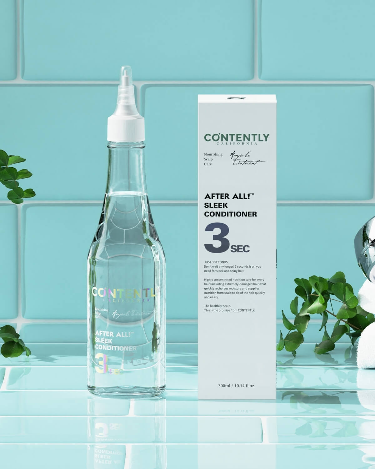 The clear conditioner bottle and its white retail box are displayed against a bright blue tiled background in a bathroom setting.