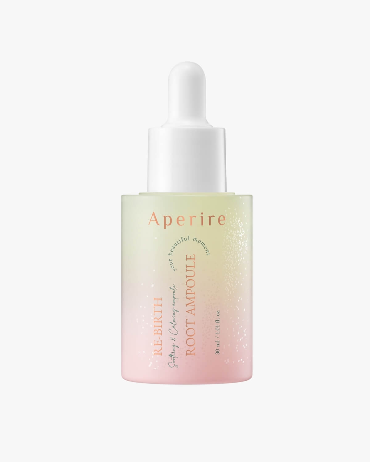 A close-up, studio shot of the Aperire Re-birth Root Ampoule bottle. The glass bottle features a gentle yellow and pink gradient and a white dropper cap. The text "Aperire," "Re-Birth Root Ampoule," and "Soothing & Calming Ampoule" is clearly visible.