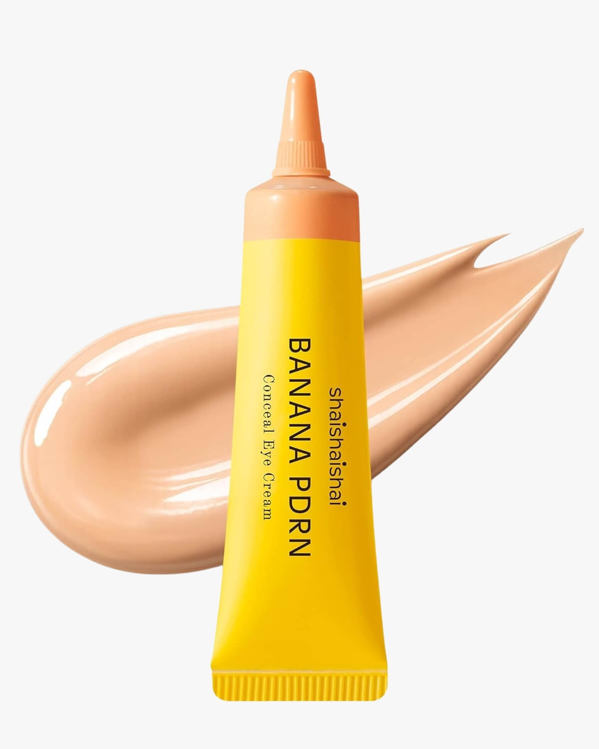 A yellow tube of shaishaishai Banana PDRN Conceal Eye Cream with a medium-light tan cream swatch in the background.