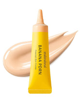 A yellow tube of shaishaishai Banana PDRN Conceal Eye Cream with a light vanilla-beige cream swatch in the background.