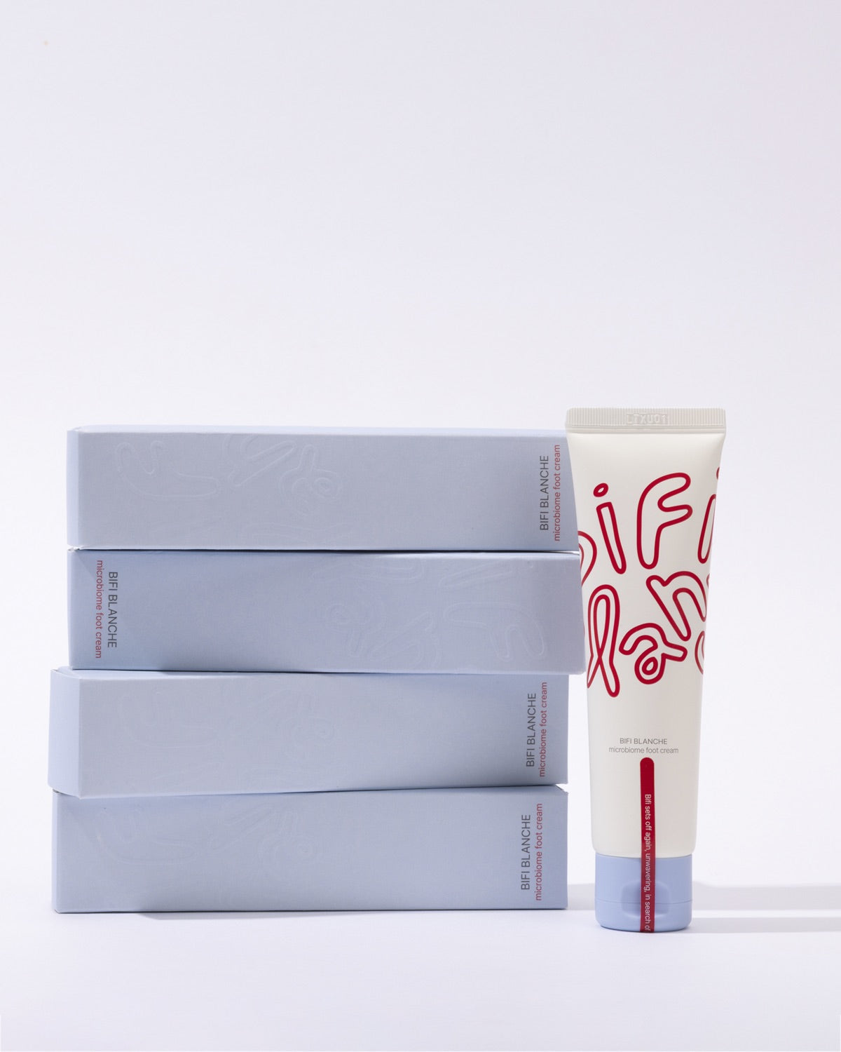 A single tube of Bifi Blanche Foot Cream standing next to a stack of four blue-gray product boxes.