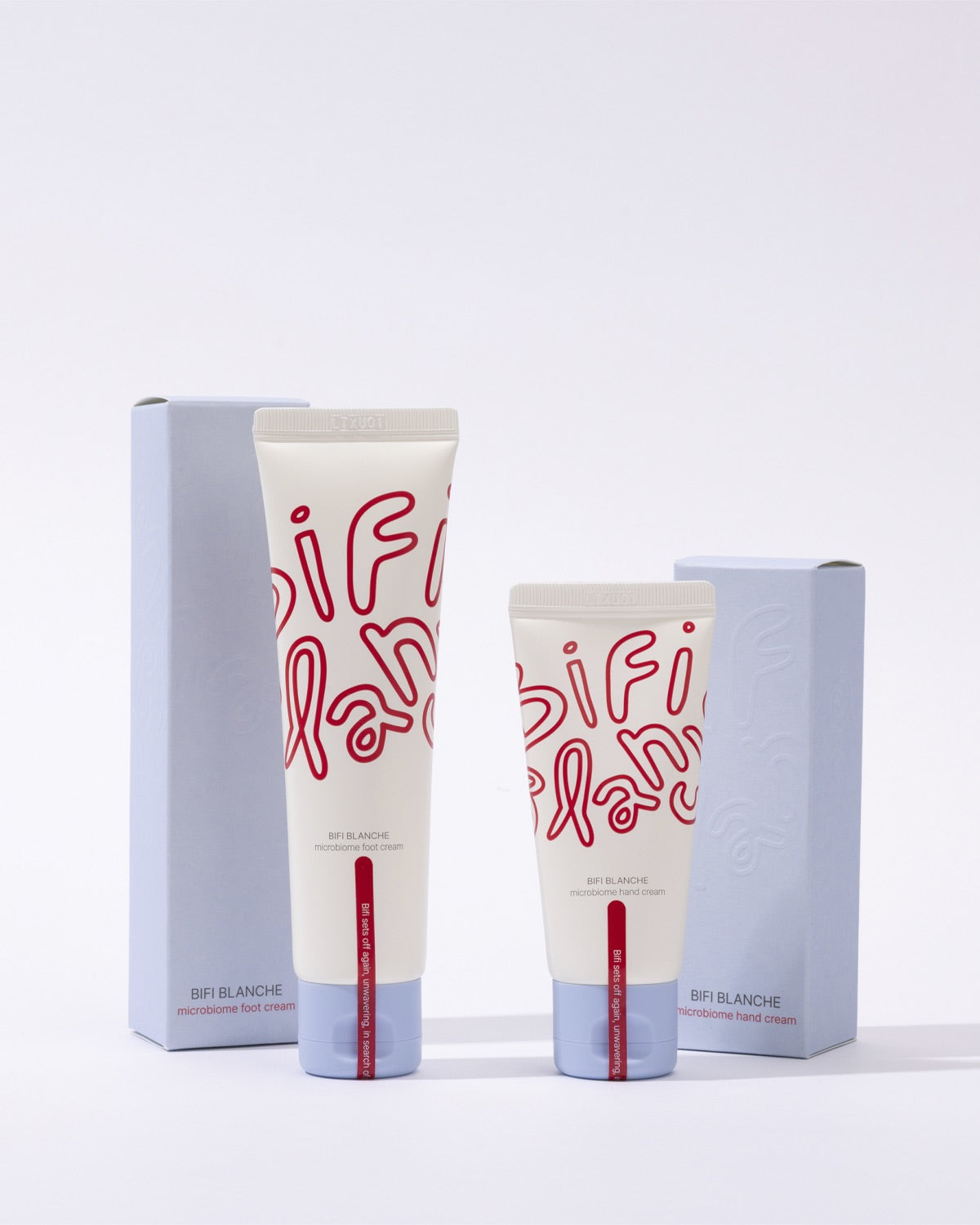An arrangement of two tubes and two product boxes for Bifi Blanche Foot Cream and Hand Cream.