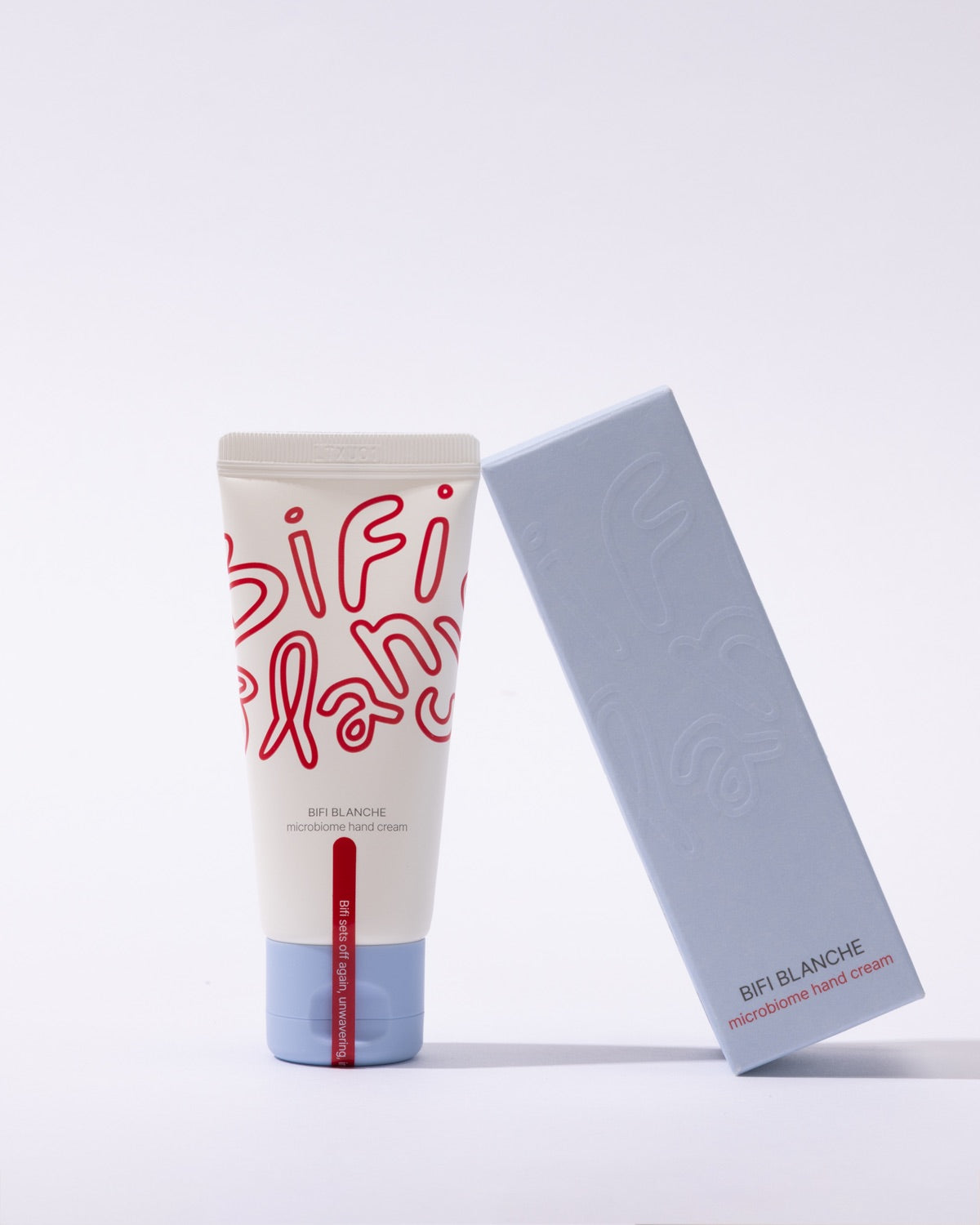 Bifi Blanche Microbiome Hand Cream tube standing upright next to its matching light blue product packaging box.