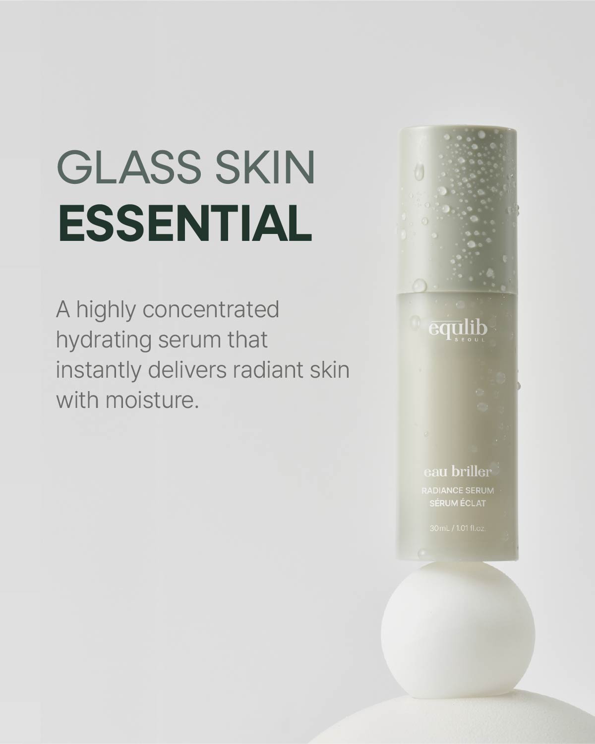 Water-droplet covered Equlib hydrating serum bottle balanced on a white sphere with glass skin essential text.