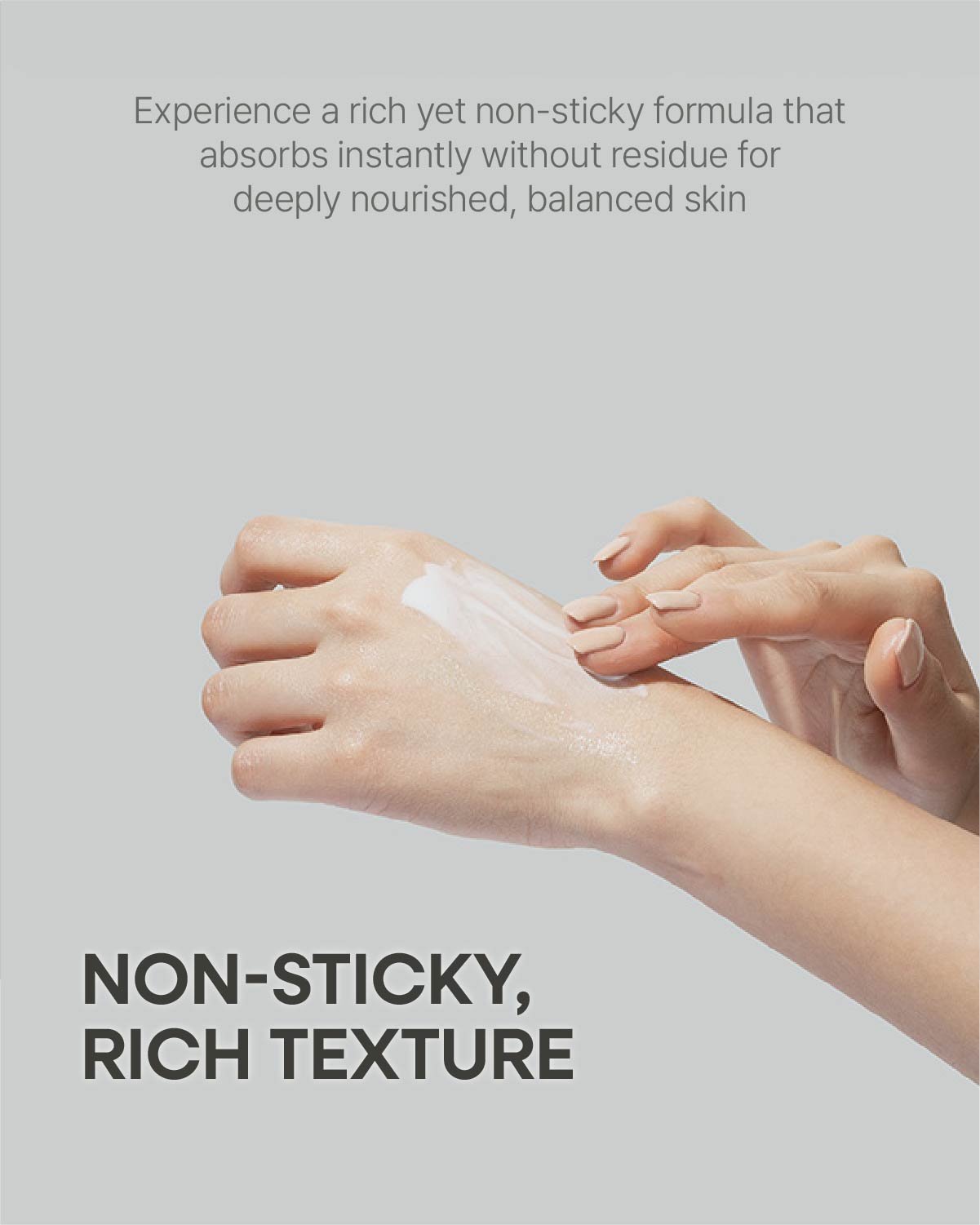 Application of a non-sticky, rich texture white cream formula on a hand demonstrating instant skin absorption.
