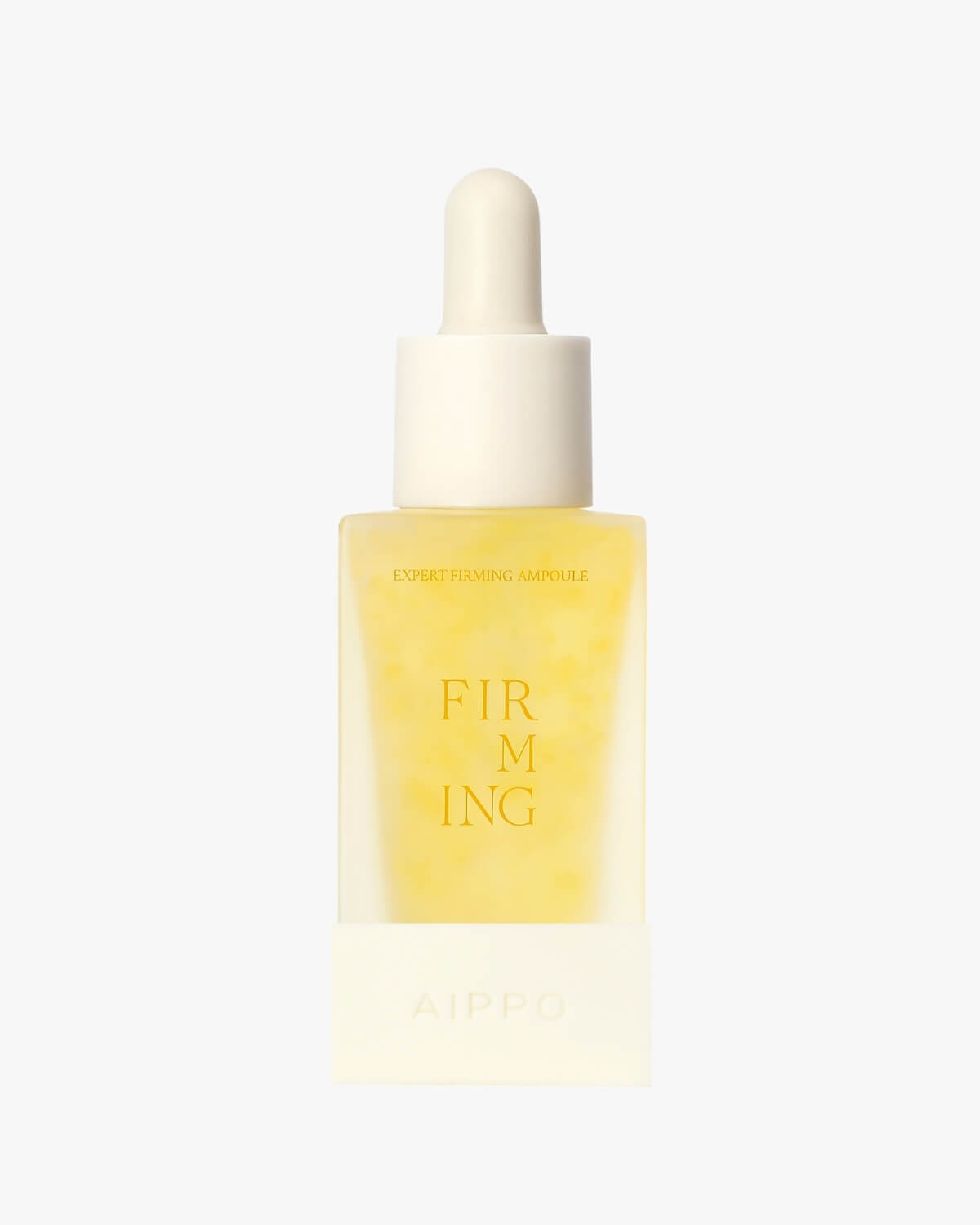 A clear, rectangular, dropper bottle of Aippo Expert Firming Ampoule. The bottle contains a light orange or amber liquid and is set against a soft, pale orange background, with "FIRMING" printed in gold on the label.