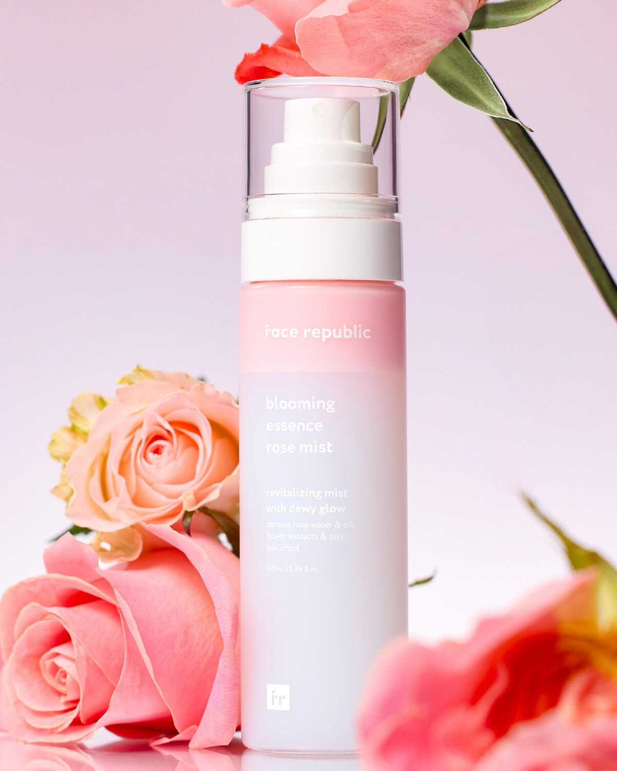 Close-up of Face Republic Blooming Essence Rose Mist bottle with pink roses and 100ml size.