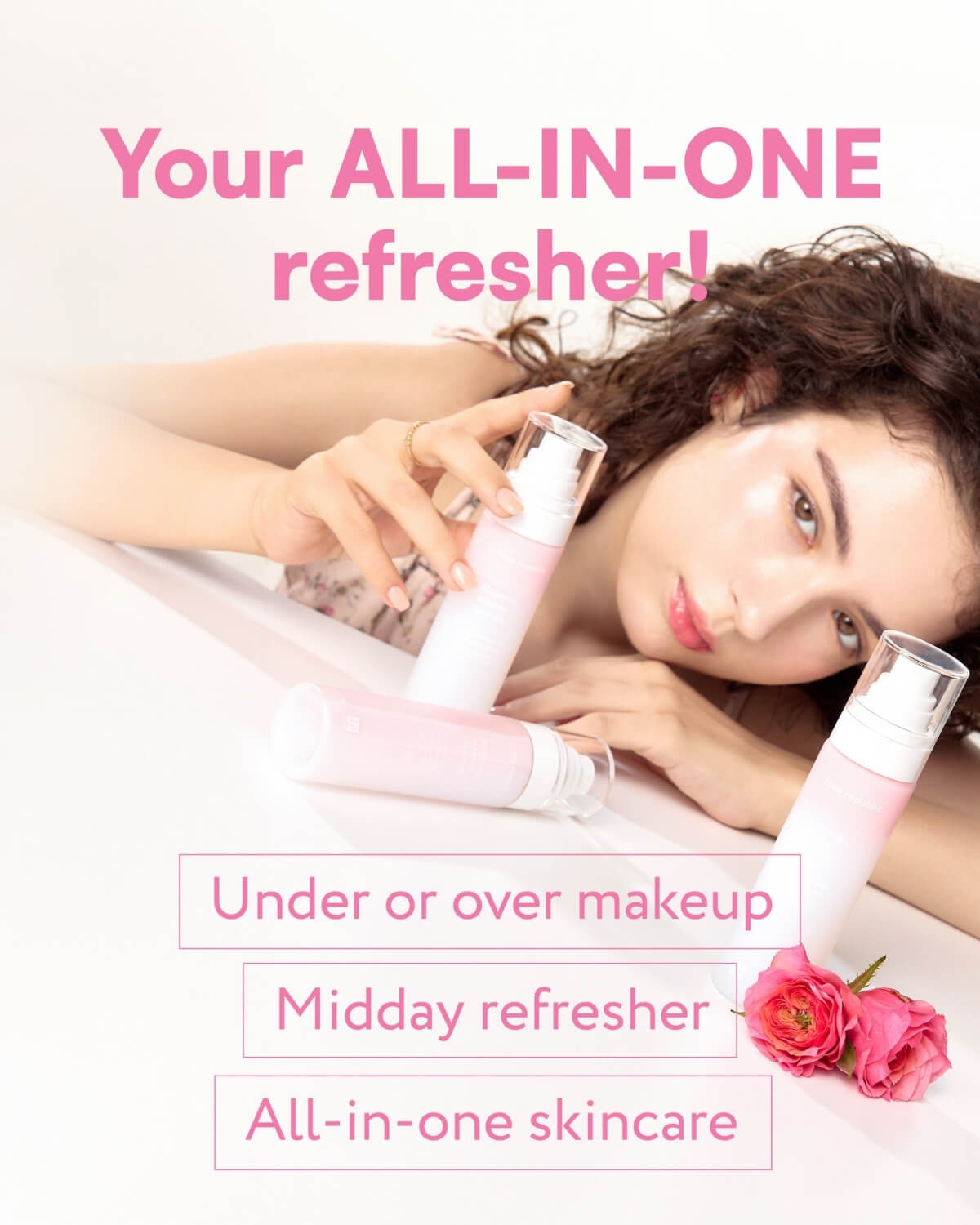 Lifestyle image of a woman with glowing skin holding Face Republic Blooming Essence Rose Mist bottles.