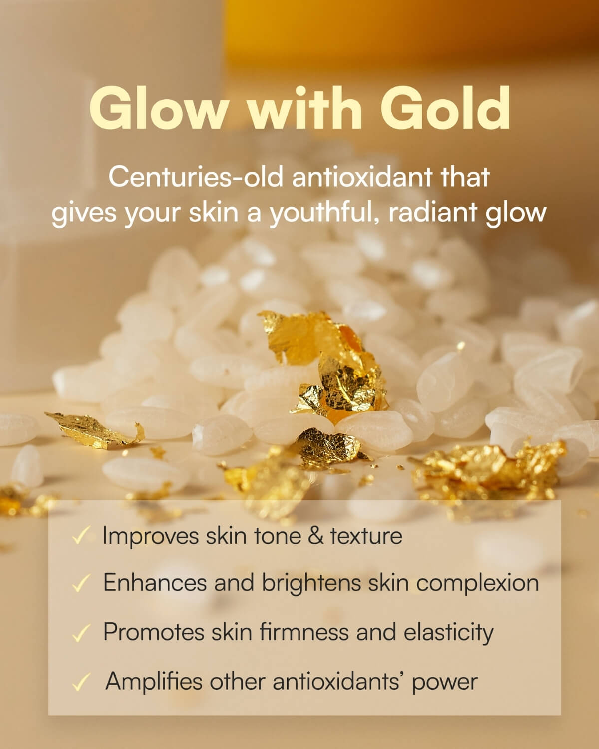 Gold leaf flakes on white rice grains highlighting the antioxidant benefits of gold in skincare.
