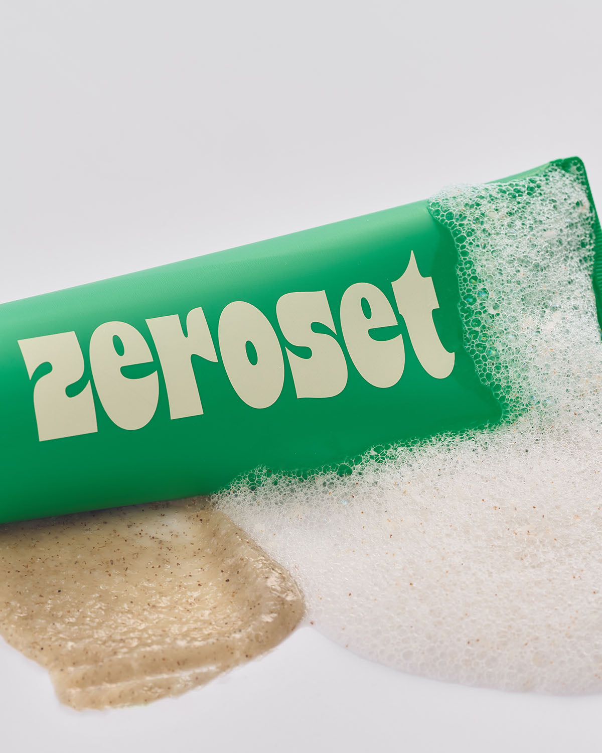 Zeroset green tea peeling to foam cleanser tube next to gel swatch and foamy lather.