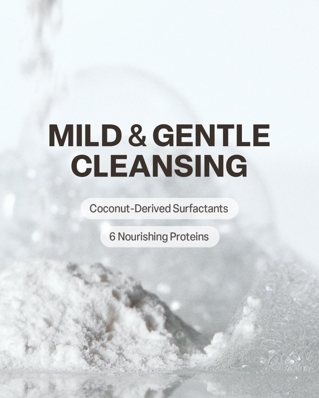 Close-up of white cleanser powder and foam with text highlighting mild and gentle coconut-derived ingredients.