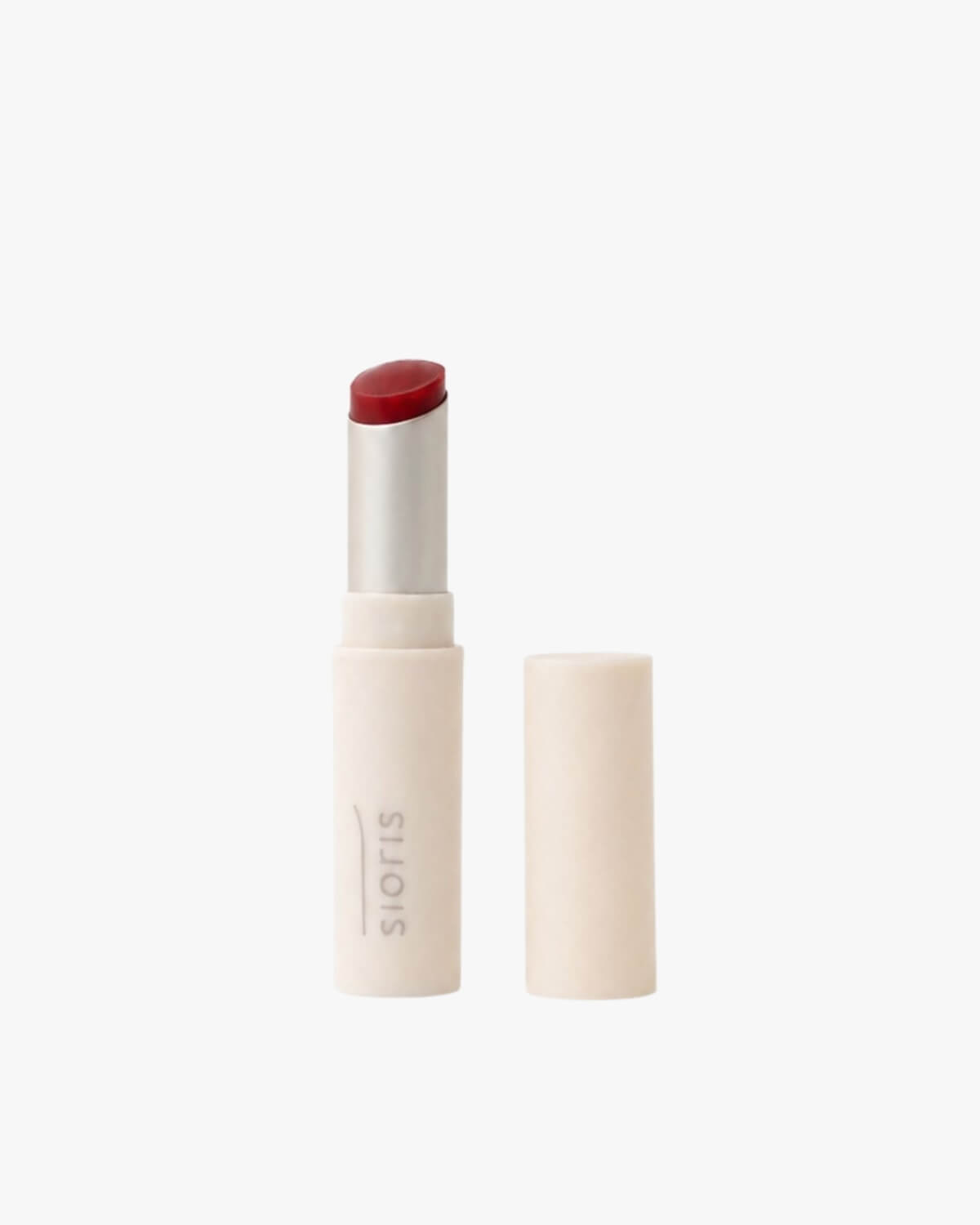 Sioris LipSafer Color Balm in Reddish shown open next to its matching minimalist cap on a white background.