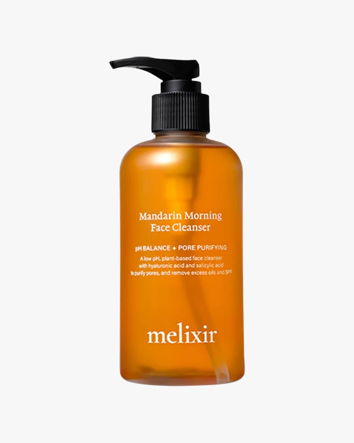 A clear amber pump bottle of Melixir Mandarin Morning Face Cleanser against a white background.