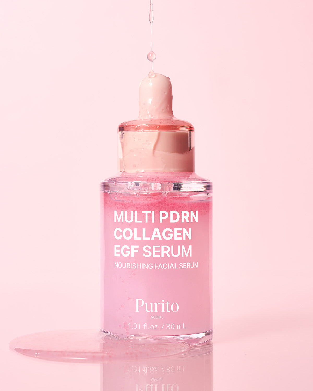 Pink Purito Multi PDRN Collagen EGF Serum being dispensed into a clear glass bottle.