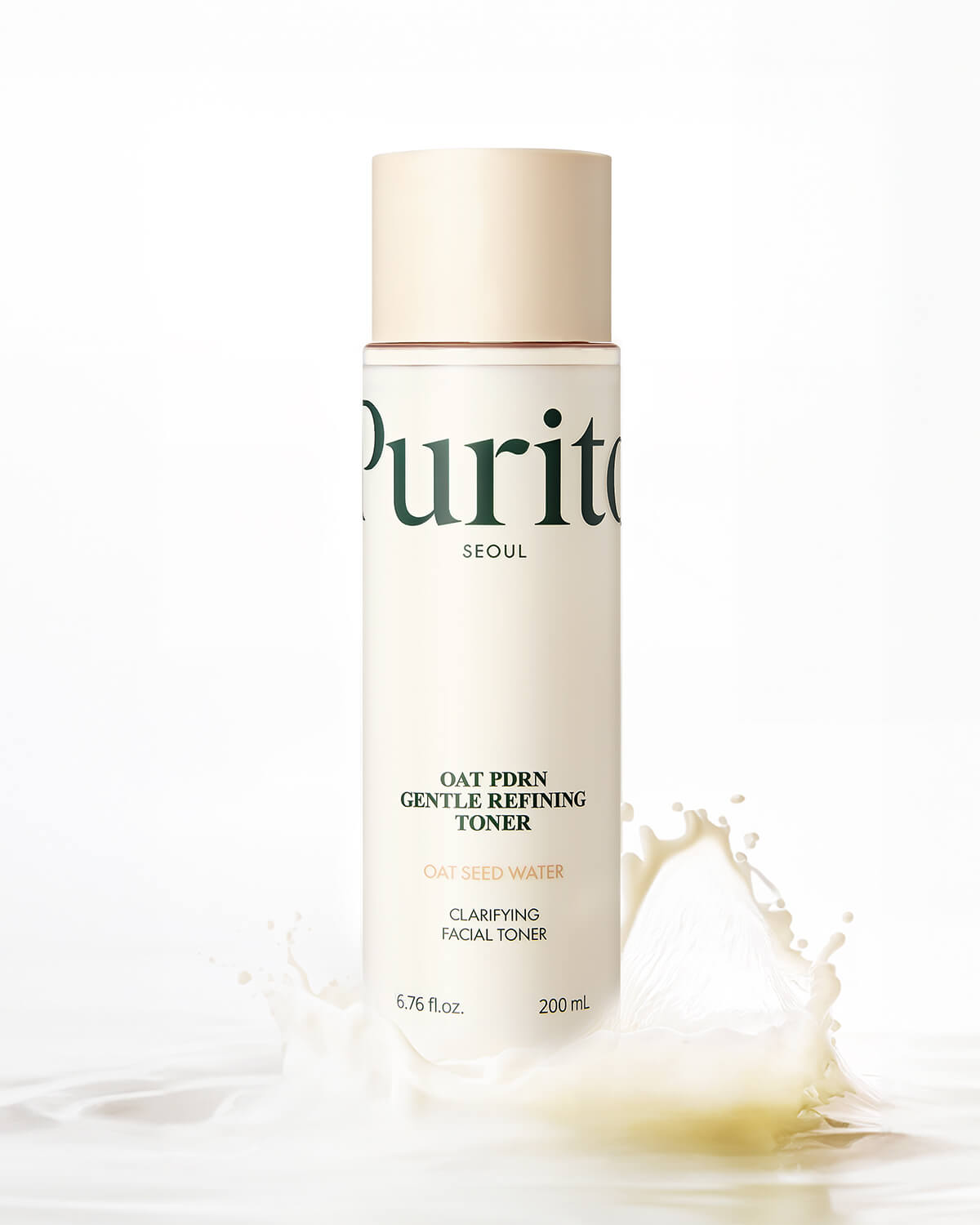 The Purito toner bottle centered behind a large, energetic splash of milky white liquid.