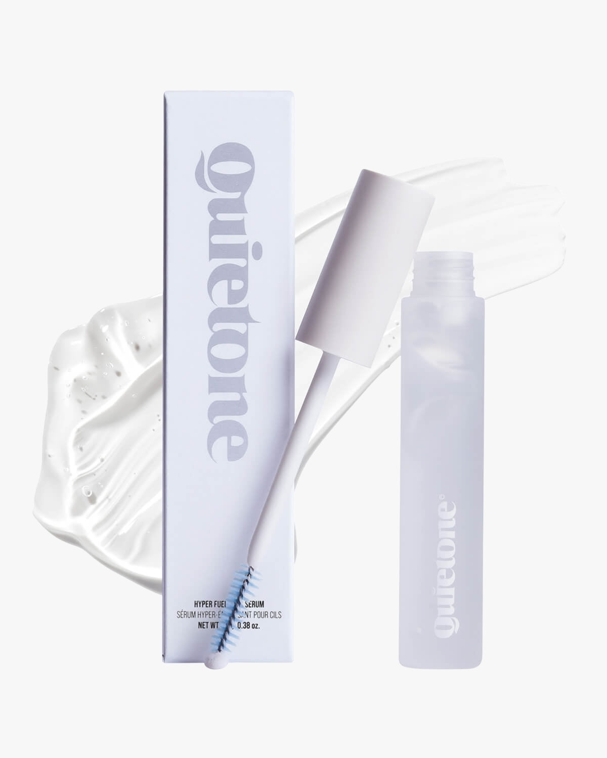 Quietone Hyper Fuel Lash Serum tube, applicator spoolie, and packaging box with a clear gel swatch background.