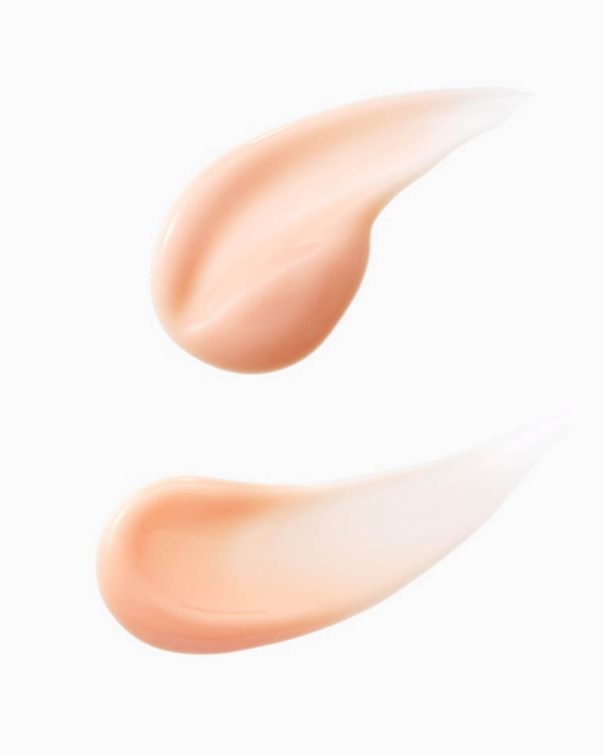 Two creamy, light peach-colored texture swatches of the PDRN & Retinol Shot Ampoule.