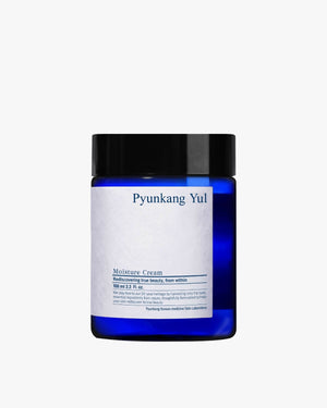 A squat, translucent dark blue jar with a black lid and a white label.