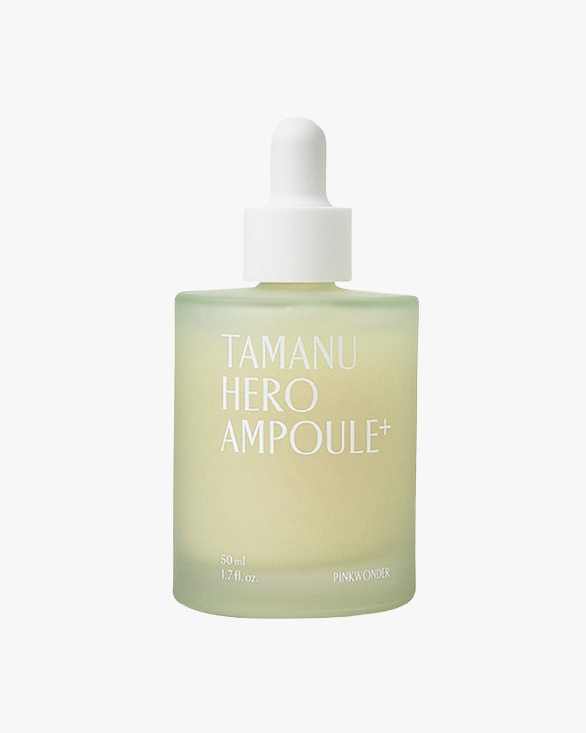 A simple product shot of the square, frosted glass bottle of Tamanu Hero Ampoule+. The pale green-yellow serum is visible beneath the white dropper cap, against a white background.