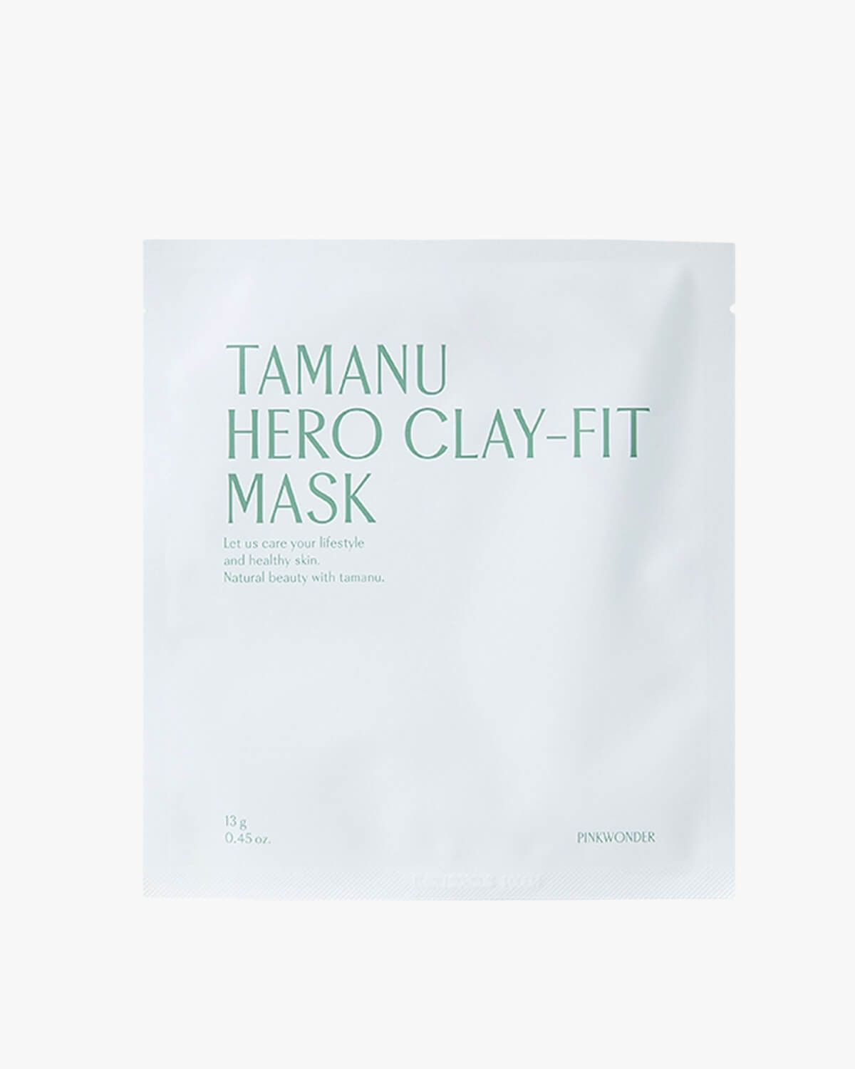 A centered, close-up shot of the white packaging for the "Tamanu Hero Clay-Fit Mask" by Pinkwonder. The text is in a light green color.