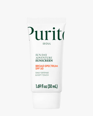 The full, upright tube of Purito Sun Day Adventure Sunscreen is displayed against a bright white background, featuring the green Purito logo, the SPF 50 Broad Spectrum rating, and the 50 ml size.