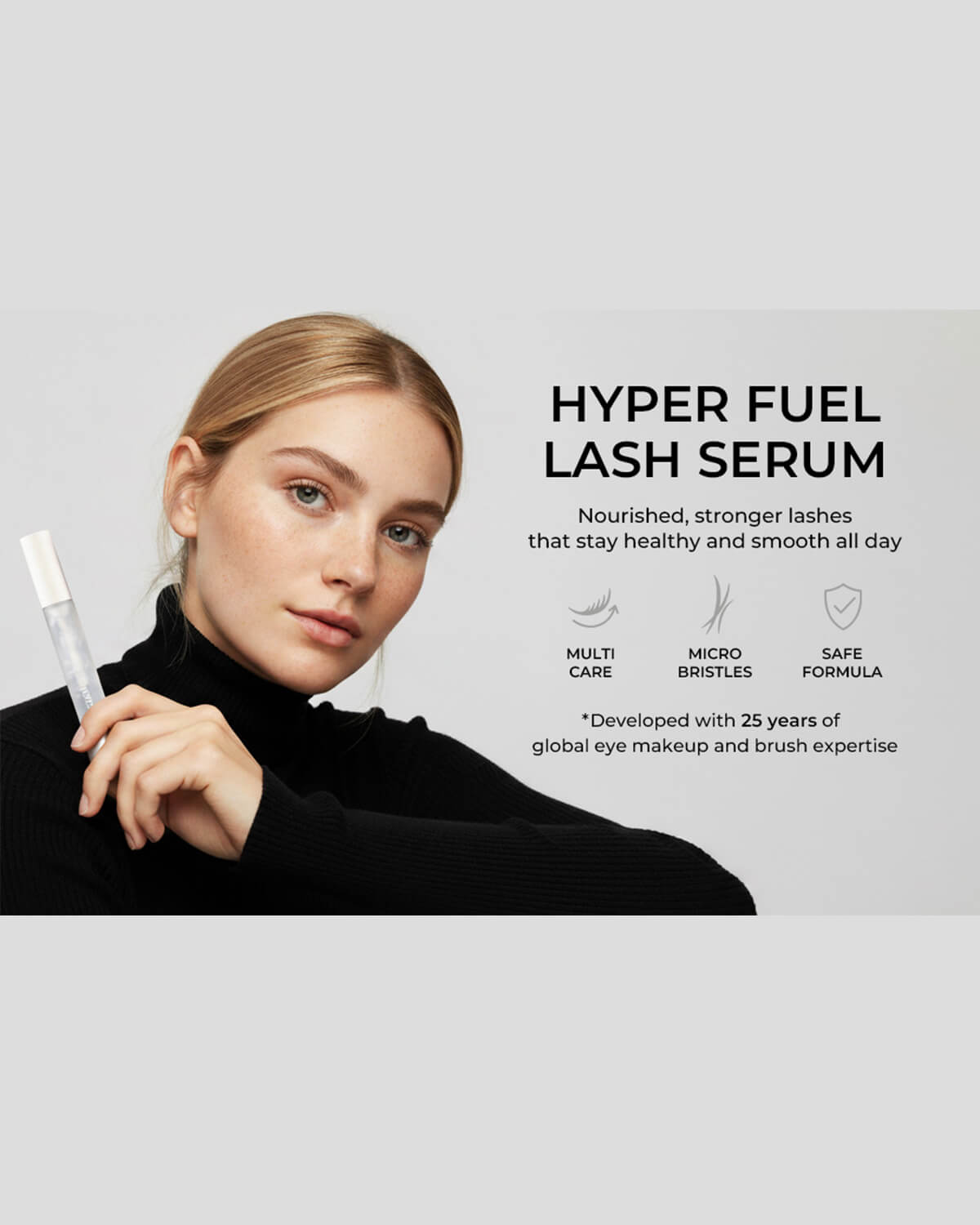 Model holding Quietone Hyper Fuel Lash Serum designed for nourished, stronger, healthy, and smooth eyelashes.