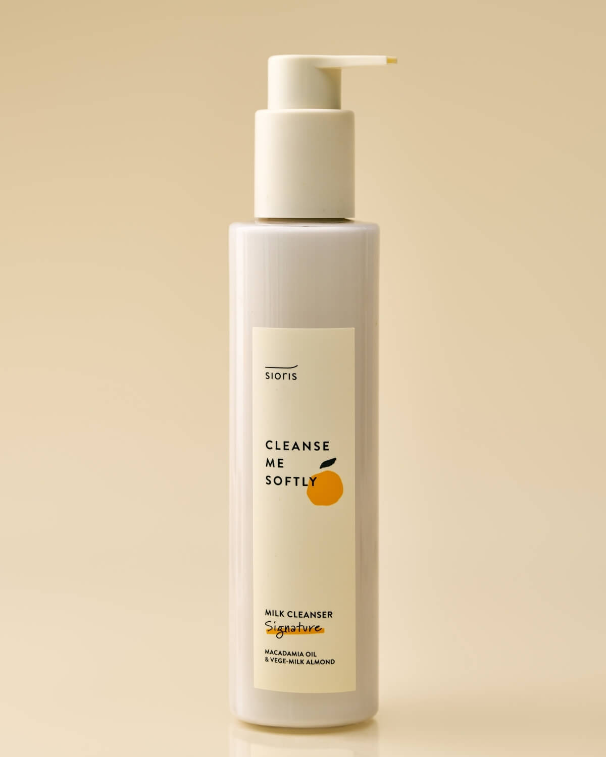 Sioris milk cleanser bottle against a soft beige background.