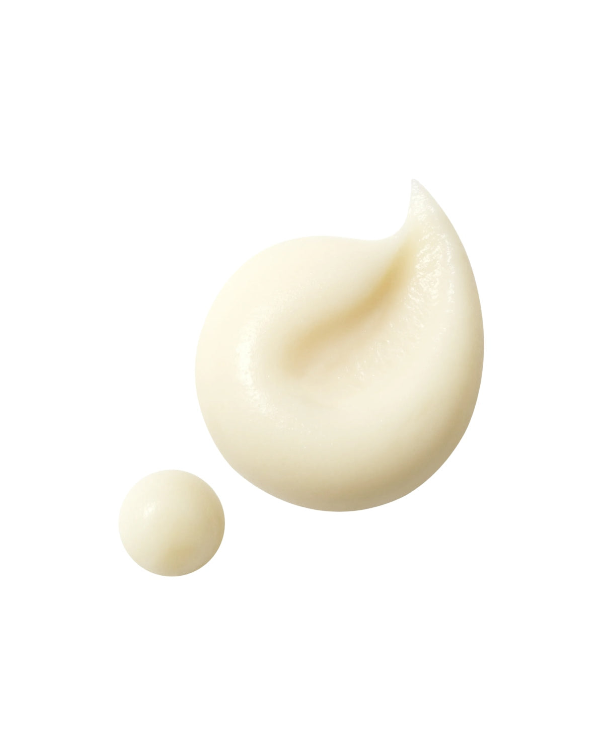 A macro shot of a thick swirl and a small round dollop of light-yellow eye cream on a white background.