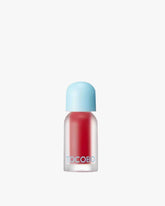 A frosted bottle of Tocobo Juicy Berry Plumping Lip Oil in the vibrant red shade 01 Chill Red.
