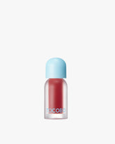 A bottle of Tocobo Juicy Berry Plumping Lip Oil in shade 05 Rosy Girl, a warm, soft rose pink.