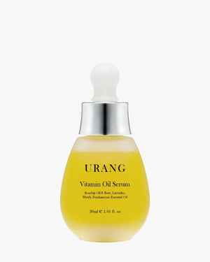 URANG Vitamin Oil Serum featuring Rosehip Oil, Lavender, and Myrrh in a frosted golden-yellow glass bottle on a white background.