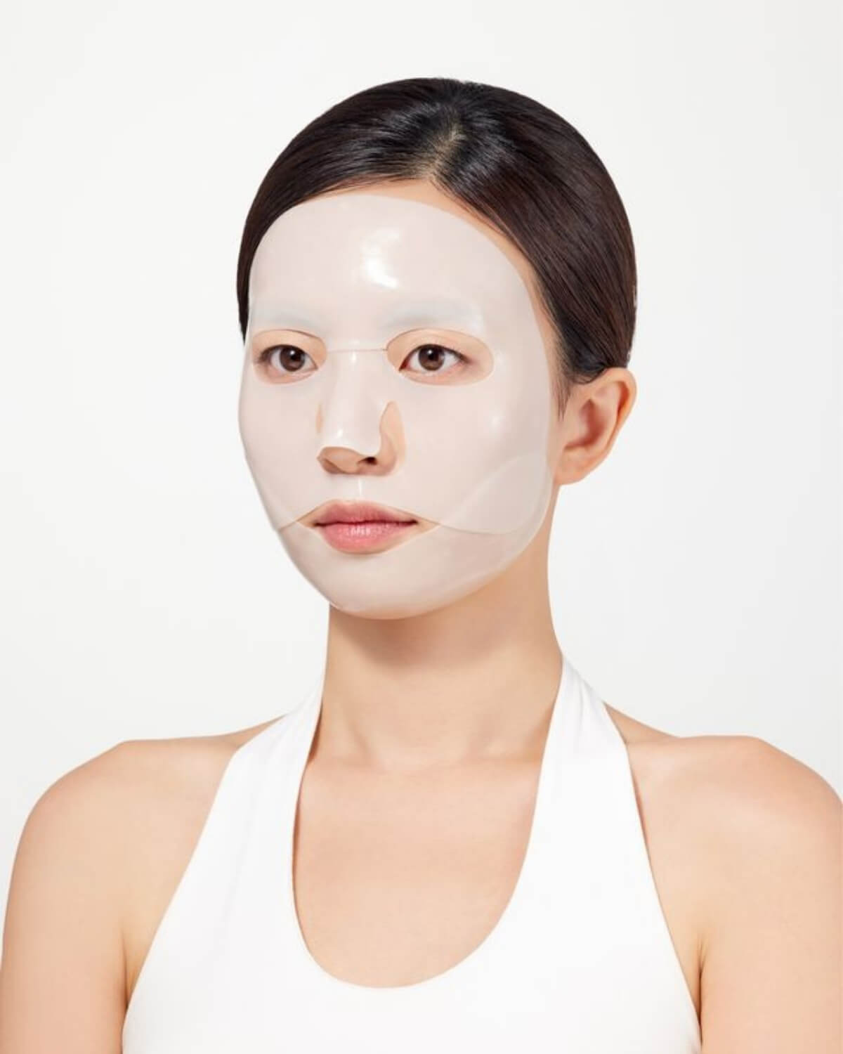 Woman wearing the Dr. Ceuracle V-Fit Tightening Gel Mask. The two-piece hydrogel mask provides a secure, contoured fit.
