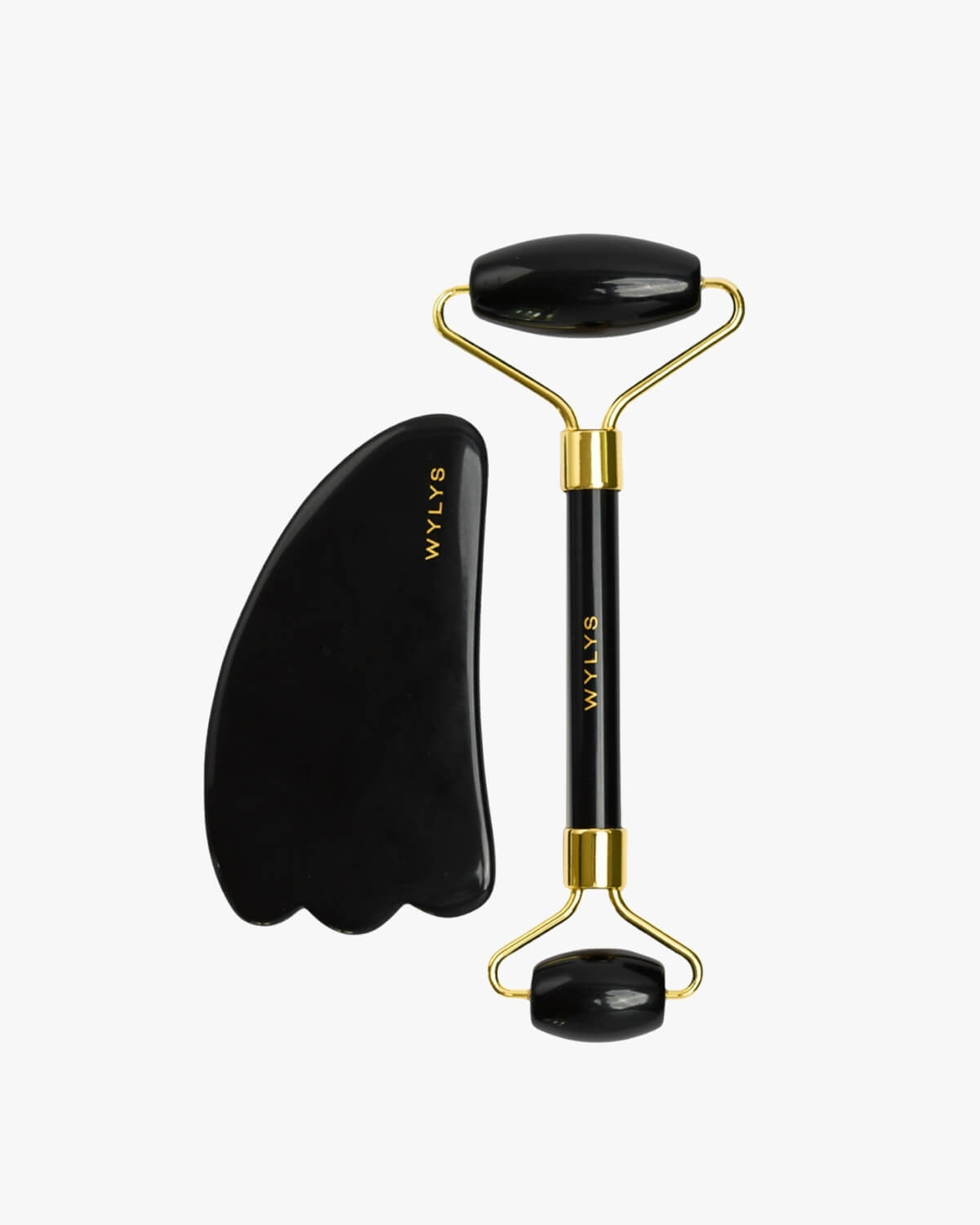WYLYS Black Obsidian Gua Sha and Facial Roller set on a white background.